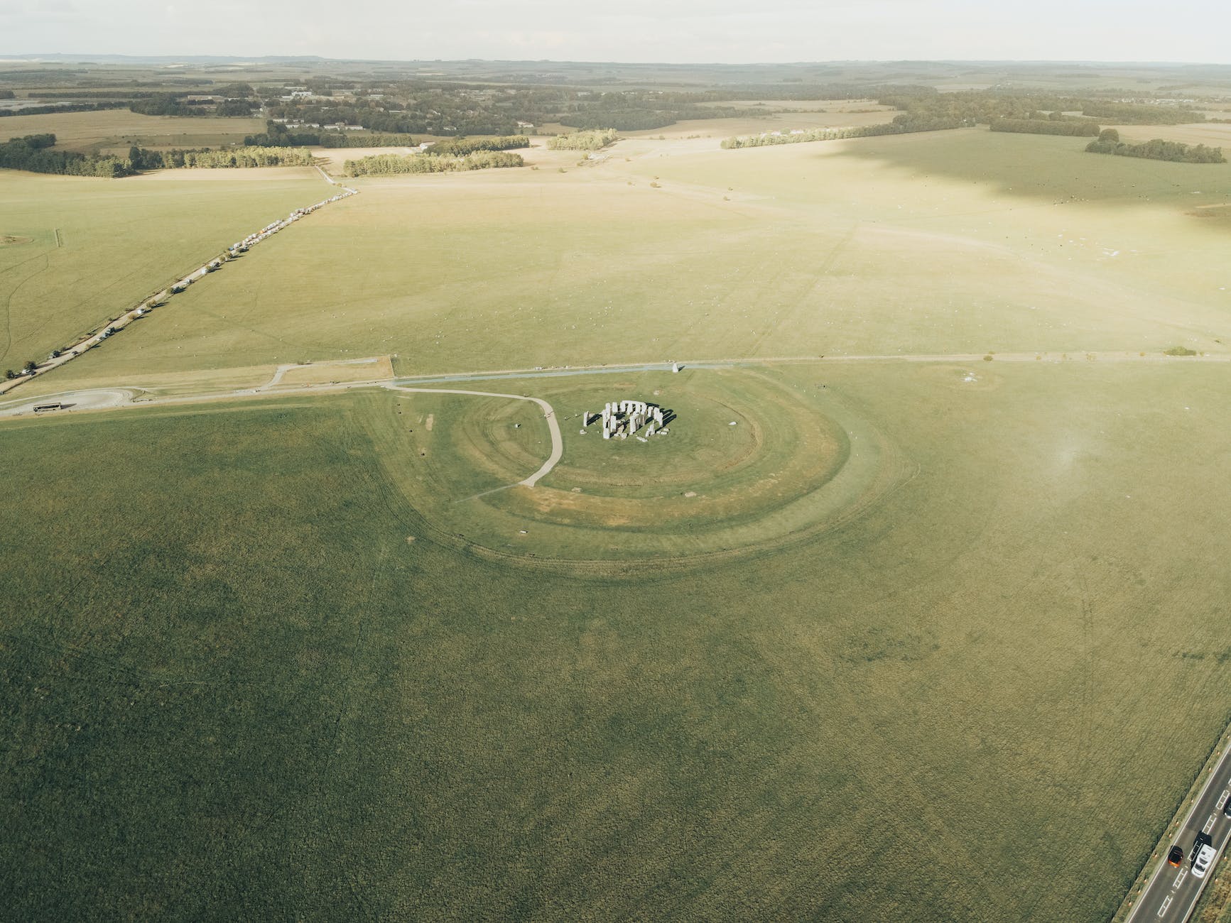 Aerial photo of Stonehenge, showing the two roads in close proximity to it. The most distant and busier road is the A303, the smaller road, closer to the stones is the minor A360. 